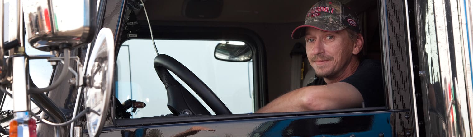 Trucker in Cab of Truck